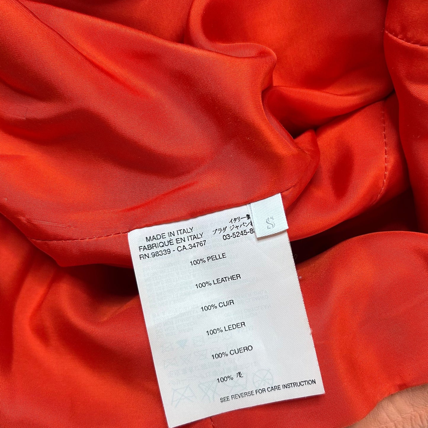 Vintage Prada Blazer / Jacket in a coral color made out of soft leather - material label.