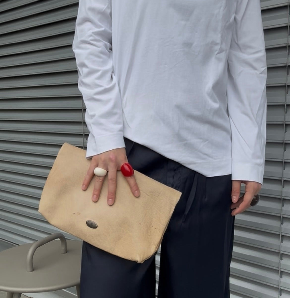 Model wears Secondhand beige leather Scotch & Soda Bag / Clutch