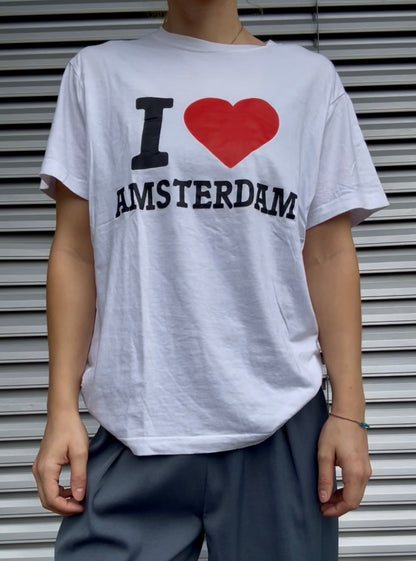 Model wears Secondhand white cotton T-Shirt with I Love Amsterdam Print