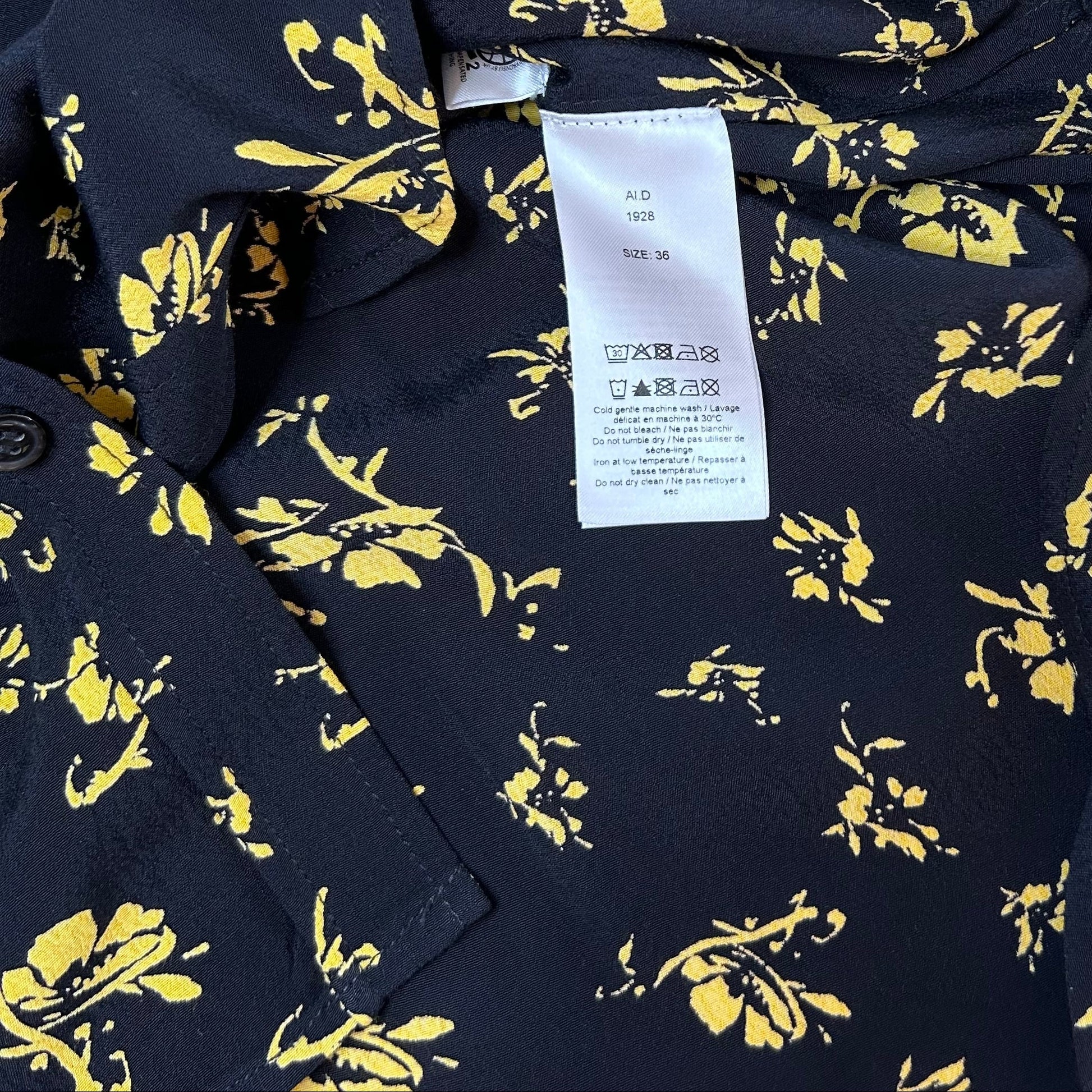 Secondhand black Ganni Blouse with yellow floral print 