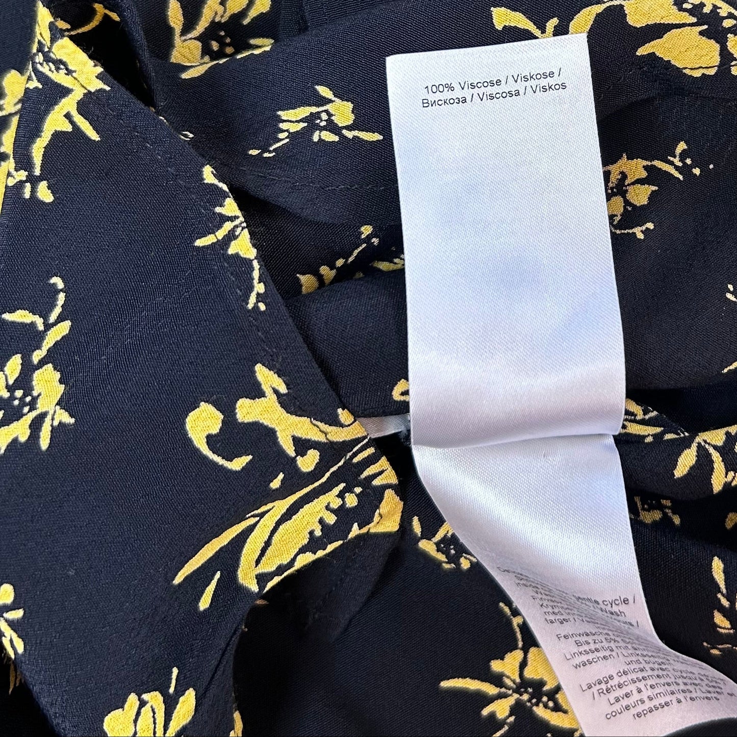 Secondhand black Ganni Blouse with yellow floral print 