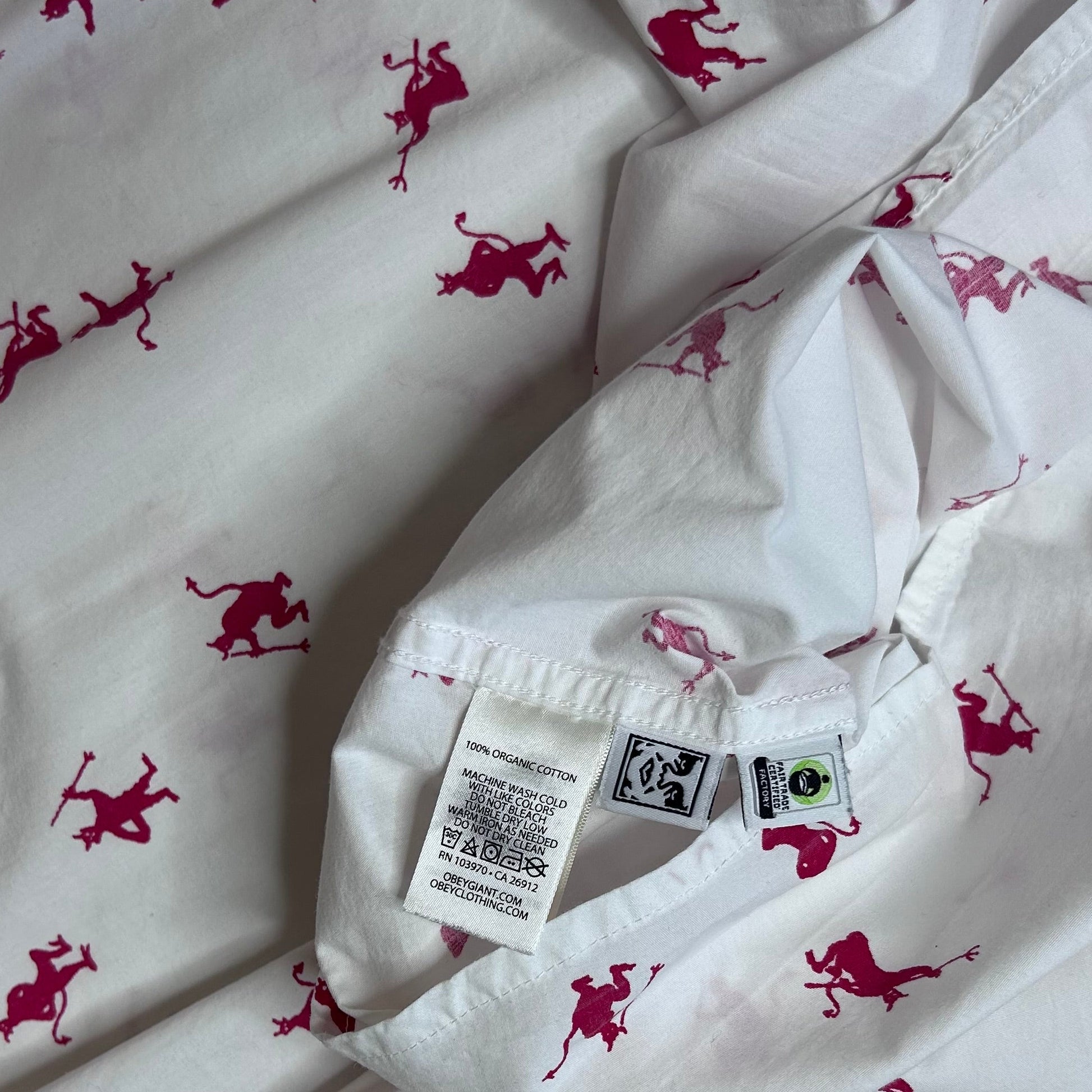 Secondhand white cotton Obey Shirt with short sleeves and red devil print 
